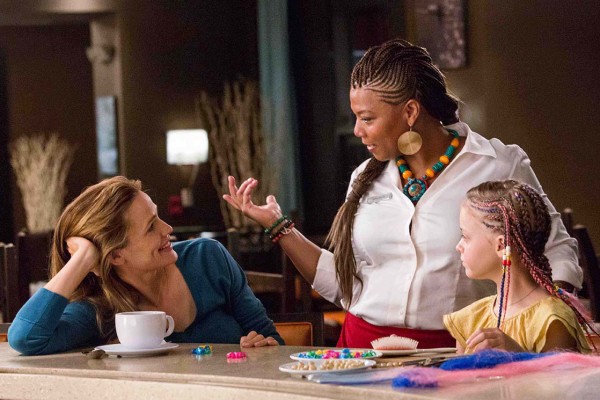 Angela (QUEEN LATIFAH) braids Anna's (KYLIE ROGERS) hair as Christy (JENNIFER GARNER) watches in Columbia Pictures' MIRACLES FROM HEAVEN.